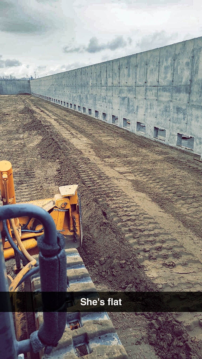 Prep for potato storage concrete slab after concrete walls